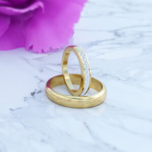 Anillos en oro de 18k de matrimonio modelo be my dream con diamantes en fondo de flor