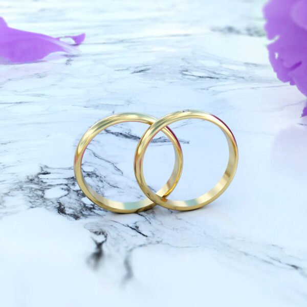 alianza de matrimonio tipo romance slim con diamante en oro de 18k en posición vertical